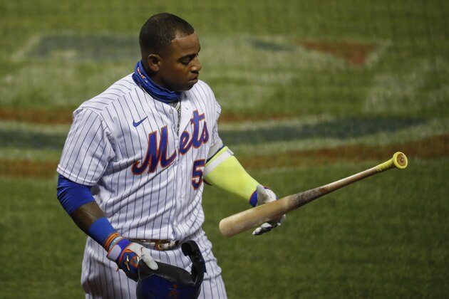 New York Mets' Yoenis Cespedes reacts after striking out against Boston Red Sox relief pitcher Marcus Walden in the sixth inning of a baseball game, Wednesday, July 29, 2020, in New York. (AP Photo/John Minchillo)