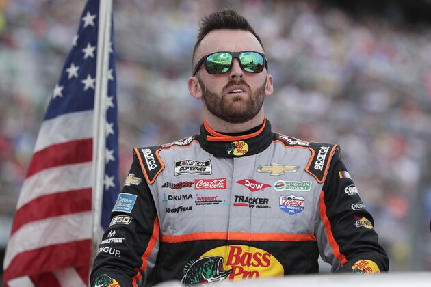 Austin Dillon takes a parade lap in front of fans before the NASCAR Daytona 500 auto race at Daytona International Speedway, Sunday, Feb. 16, 2020, in Daytona Beach, Fla. (AP Photo/John Raoux)