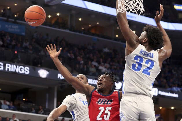 Memphis' James Wiseman (32) guards Illinois-Chicago's Godwin Boahen (25) during the first half of an NCAA college basketball game Friday, Nov. 8, 2019, in Memphis, Tenn. (AP Photo/Karen Pulfer Focht)