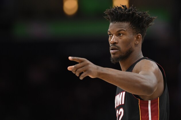 Miami Heat forward Jimmy Butler (22) points during the first half of an NBA basketball game against the Washington Wizards, Sunday, March 8, 2020, in Washington. (AP Photo/Nick Wass)