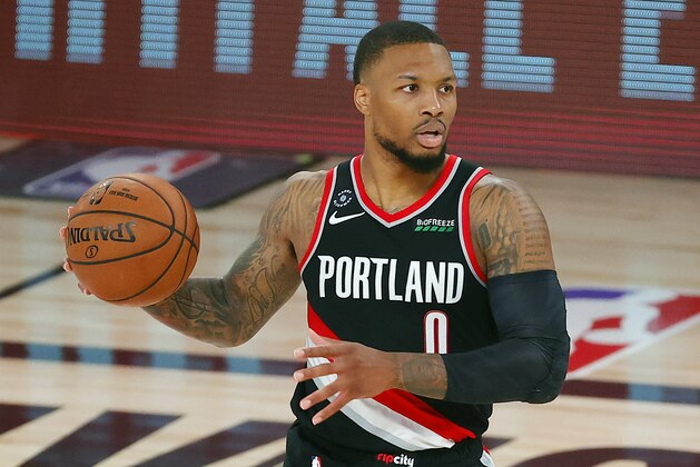 Portland Trail Blazers' Damian Lillard (0) dribbles during the second half of an NBA basketball game against the Houston Rockets Tuesday, Aug. 4, 2020, in Lake Buena Vista, Fla. (Kevin C. Cox/Pool Photo via AP)