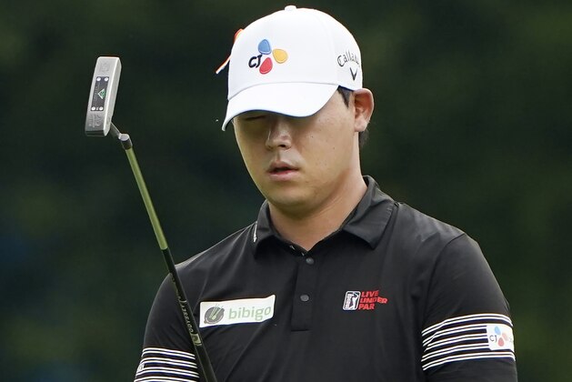 Si Woo Kim, of South Korea, lines up a putt on the first hole during the third round of the Wyndham Championship golf tournament at Sedgefield Country Club on Saturday, Aug. 15, 2020, in Greensboro, N.C. (AP Photo/Chris Carlson)