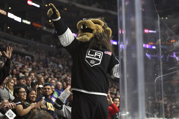 Los Angeles Kings mascot Bailey entertains the crowd during a preseason NHL hockey game against the Anaheim Ducks, Saturday, Sept. 30, 2017, in Los Angeles. (AP Photo/Michael Owen Baker)