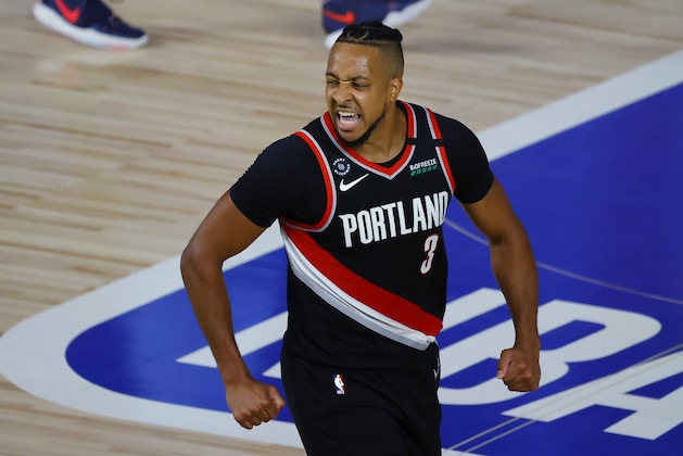 Portland Trail Blazers' CJ McCollum reacts to a shot against the Memphis Grizzlies during the second half of an NBA basketball game Saturday, Aug. 15, 2020, in Lake Buena Vista, Fla. (Kevin C. Cox/Pool Photo via AP)