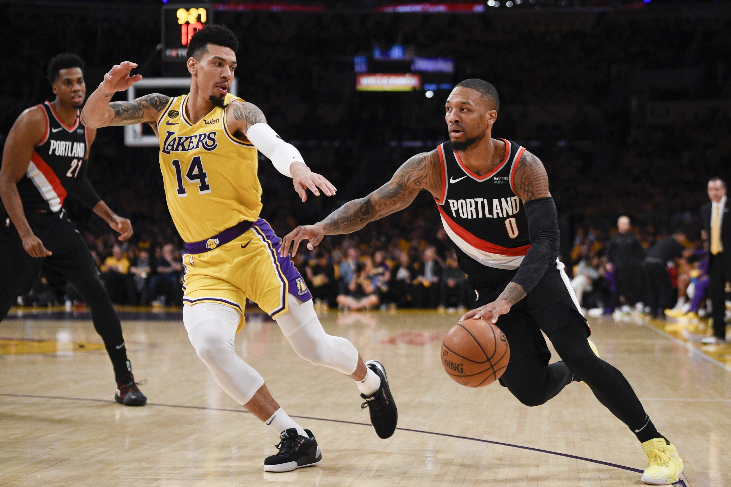 Portland Trail Blazers guard Damian Lillard, right, drives to the basket while Los Angeles Lakers guard Danny Green defends during the first half of an NBA basketball game in Los Angeles, Friday, Jan. 31, 2020. (AP Photo/Kelvin Kuo)
