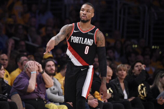 Portland Trail Blazers guard Damian Lillard reacts after making a three-point shot during the second half of an NBA basketball game against the Los Angeles Lakers in Los Angeles, Friday, Jan. 31, 2020. (AP Photo/Kelvin Kuo)