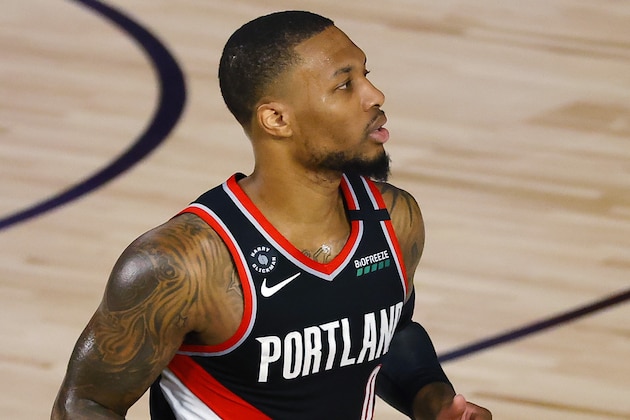 Portland Trail Blazers' Damian Lillard moves the ball against the Memphis Grizzlies during the first half of an NBA basketball game Saturday, Aug. 15, 2020, in Lake Buena Vista, Fla. (Kevin C. Cox/Pool Photo via AP)