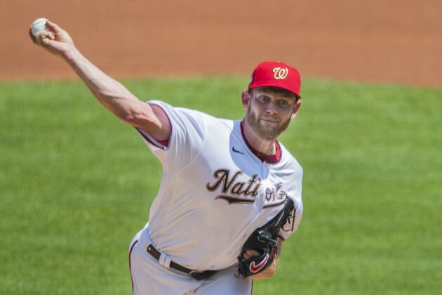 Washington Nationals starting pitcher Stephen Strasburg throws during the first inning of a baseball game against the Baltimore Orioles in Washington, Sunday, Aug. 9, 2020. (AP Photo/Manuel Balce Ceneta)