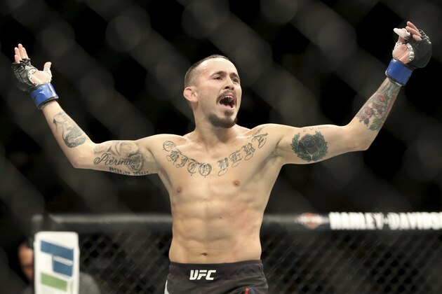 Marlon Vera celebrates a win against Brian Kelleher after their mixed martial arts bout at UFC on Fox 25, Saturday, July 22, 2017, in New York. Vera won via submission. (AP Photo/Steve Luciano)