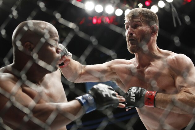 Stipe Miocic, right, fights Daniel Cormier in a heavyweight title mixed martial arts bout at UFC 226, Saturday, July 7, 2018, in Las Vegas. (AP Photo/John Locher)