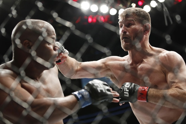 Stipe Miocic, right, fights Daniel Cormier in a heavyweight title mixed martial arts bout at UFC 226, Saturday, July 7, 2018, in Las Vegas. (AP Photo/John Locher)