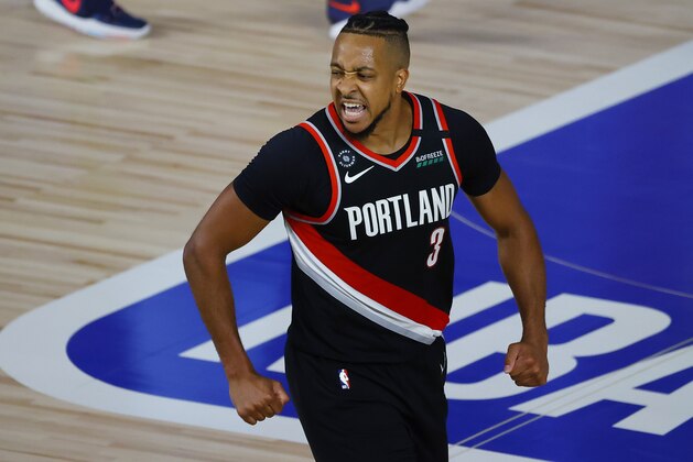 Portland Trail Blazers' CJ McCollum reacts to a shot against the Memphis Grizzlies during the second half of an NBA basketball game Saturday, Aug. 15, 2020, in Lake Buena Vista, Fla. (Kevin C. Cox/Pool Photo via AP)