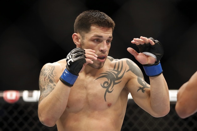 Daniel Pineda, left, in action against Diego Brandao during their UFC on Fox Sports 1 mixed martial arts bout in Boston, Saturday, August 17,2013. Brandao won via decison. (AP Photo/Gregory Payan)