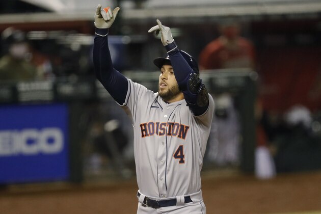 Houston Astros' George Springer (4) crosses the plate after hitting a two run home run against the Arizona Diamondbacks during the fifth inning of a baseball game Wednesday, Aug. 5, 2020, in Phoenix. (AP Photo/Matt York)