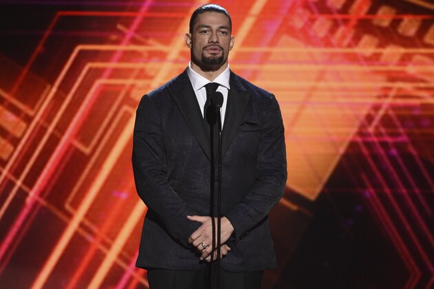 Roman Reigns presents the best coach award at the ESPY Awards on Wednesday, July 10, 2019, at the Microsoft Theater in Los Angeles. (Photo by Chris Pizzello/Invision/AP)