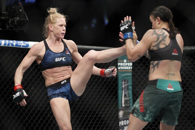 Holly Holm kicks Raquel Pennington during a UFC 246 women's bantamweight mixed martial arts bout Saturday, Jan. 18, 2020, in Las Vegas. (AP Photo/John Locher)