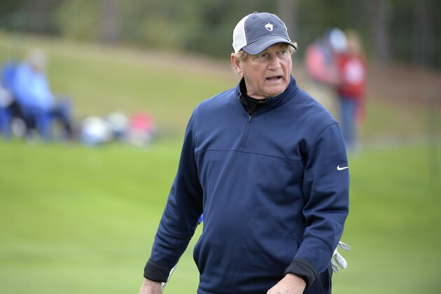 Joe Theismann walks off the 18th green after making a putt during the final round of the Tournament of Champions LPGA golf tournament Sunday, Jan. 20, 2019, in Lake Buena Vista, Fla. (AP Photo/Phelan M. Ebenhack)