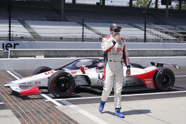 Marco Andretti walks away from his car after posing for a photo during qualifications for the Indianapolis 500 auto race at Indianapolis Motor Speedway, Saturday, Aug. 15, 2020, in Indianapolis. (AP Photo/Darron Cummings)