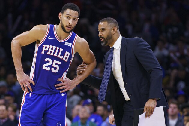 Philadelphia 76ers' Ben Simmons, left, listens to assistant coach Ime Udoka, right, during the second half of an NBA basketball game against the Sacramento Kings, Wednesday, Nov. 27, 2019, in Philadelphia. The 76ers won 97-91. (AP Photo/Chris Szagola)