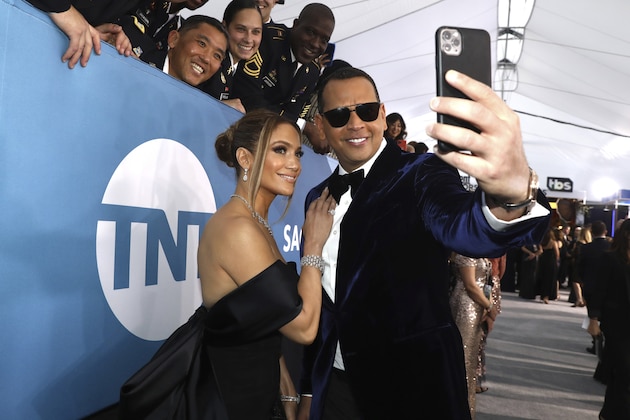 Jennifer Lopez, left, and Alex Rodriguez take a selfie as they arrive at the 26th annual Screen Actors Guild Awards at the Shrine Auditorium & Expo Hall on Sunday, Jan. 19, 2020, in Los Angeles. (Photo by Matt Sayles/Invision/AP)
