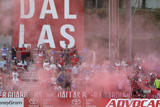 FC Dallas fans celebrate a goal against Minnesota United during an MLS soccer match in Frisco, Texas, Saturday, Aug. 10, 2019. (AP Photo/Tony Gutierrez)