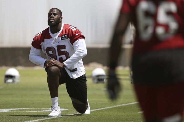 Arizona Cardinals defensive lineman Rodney Gunter stretches out during drills at the team's NFL football training facility, Wednesday, June 12, 2019, in Tempe, Ariz. (AP Photo/Ross D. Franklin)