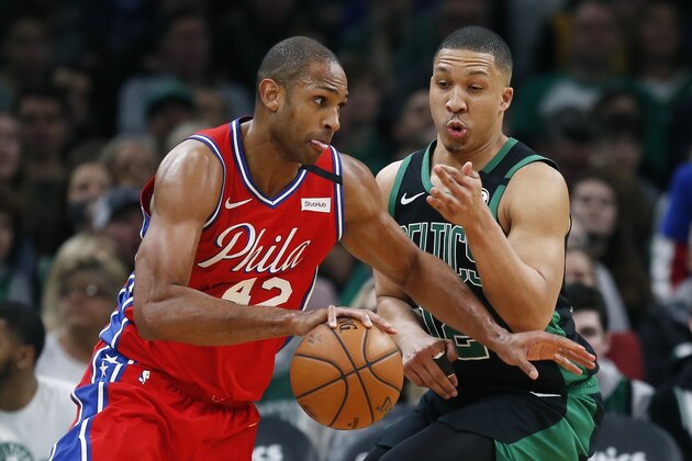 Philadelphia 76ers' Al Horford (42) drives past Boston Celtics' Grant Williams (12) during the first half of an NBA basketball game in Boston, Saturday, Feb. 1, 2020. (AP Photo/Michael Dwyer)