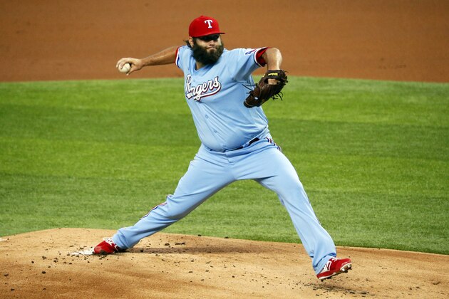 Texas Rangers starting pitcher Lance Lynn delivers to the Los Angeles Angels in the first inning of a baseball game in Arlington, Texas, Sunday, Aug. 9, 2020. (AP Photo/Ray Carlin)