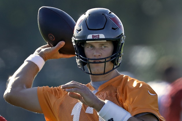 Tampa Bay Buccaneers quarterback Tom Brady (12) throws a pass during an NFL football organized team activity Thursday, Aug. 13, 2020, in Tampa, Fla. (AP Photo/Chris O'Meara)