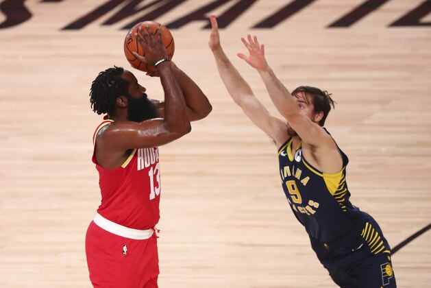 Houston Rockets guard James Harden (13) takes a shot over Indiana Pacers guard T.J. McConnell (9) in the first half of an NBA basketball game Wednesday, Aug. 12, 2020, in Lake Buena Vista, Fla. (Kim Klement/Pool Photo via AP)