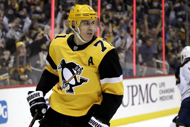 FILE - Pittsburgh Penguins' Evgeni Malkin looks for teammates to celebrate his goal with during the second period of the team's NHL hockey game against the Buffalo Sabres in Pittsburgh, Saturday, Feb. 22, 2020. Malkin says he's ready for the playoffs. The 33-year-old Russian says the long “pause” to the NHL season created by the COVID-19 gave him a renewed appreciation for playing the game. Malkin helped carry the Penguins during an injury-marred first half of the season and he was leading the team in points by a wide margin at the time of the shutdown. (AP Photo/Gene J. Puskar, file)