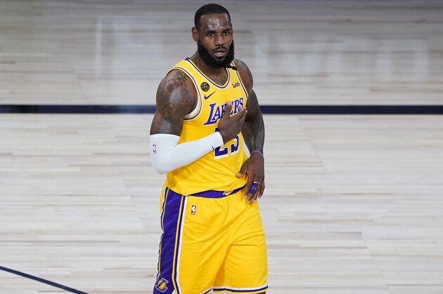 Los Angeles Lakers' LeBron James (23) reacts after a basket during the first half of an NBA basketball game against the Denver Nuggets, Monday, Aug. 10, 2020, in Lake Buena Vista, Fla. (AP Photo/Ashley Landis, Pool)