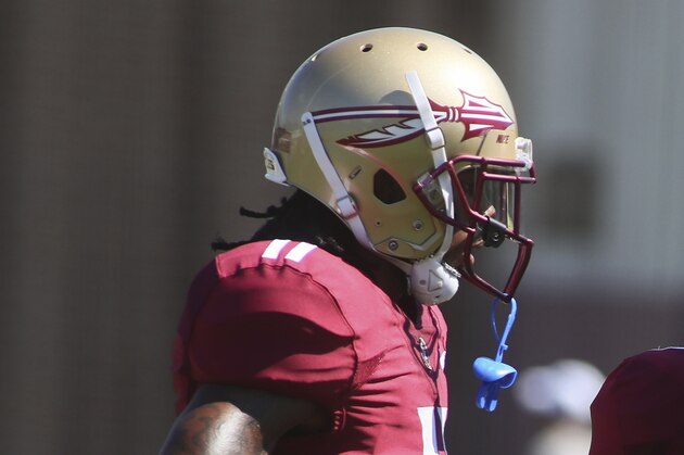 Florida State wide receivers Warren Thompson (11) and D.J. Matthews (7) talk during an NCAA college football preseason practice Sunday, Aug. 4, 2019, in Tallahassee, Fla. (AP Photo/Phil Sears)