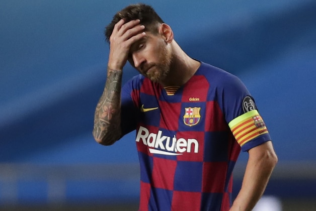 Barcelona's Lionel Messi holds his head during the Champions League quarterfinal match between FC Barcelona and Bayern Munich at the Luz stadium in Lisbon, Portugal, Friday, Aug. 14, 2020. (AP Photo/Manu Fernandez/Pool)