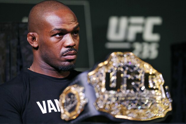 FILE - In this Jan. 31, 2019, file photo, Light heavyweight champion Jon Jones attends a news conference for the UFC 235 mixed martial arts event in Las Vegas. Jones will be allowed to fight at UFC 235 on Saturday despite two recent drug tests showing traces of a steroid metabolite, the Nevada State Athletic Commission announced Thursday, Feb. 28, 2019, The commission affirmed its belief that the tests do not reflect new drug use and believes the two positive tests conducted Feb. 14 and 15 uncovered residual results from the drug intake that resulted in a 15-month suspension for Jones in 2017. (AP Photo/John Locher, File)
