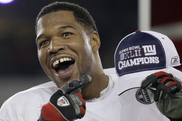 New York Giants defensive end Michael Strahan celebrates after the Giants beat the New England Patriots 17-14 in the Super Bowl XLII football game on Sunday, Feb. 3, 2008, in Glendale, Ariz.(AP Photo/David J. Phillip)