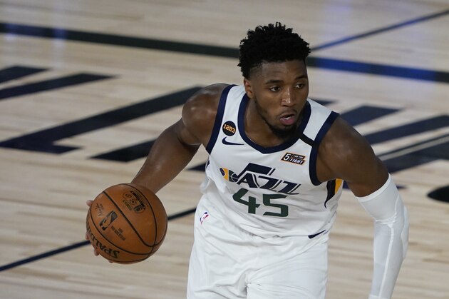 Utah Jazz guard Donovan Mitchell (45) takes the ball down the court during an NBA basketball game against the New Orleans Pelicans Thursday, July 30, 2020, in Lake Buena Vista, Fla. (AP Photo/Ashley Landis, Pool)