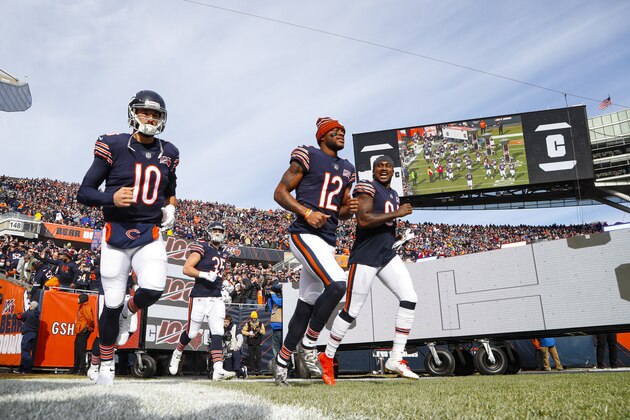 The Chicago Bears, including quarterback Mitchell Trubisky (10), wide receiver Allen Robinson (12) and outside linebacker Leonard Floyd (94) take the field before an NFL football game against the New York Giants in Chicago, Sunday, Nov. 24, 2019. (AP Photo/Paul Sancya)