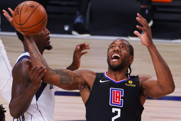 Los Angeles Clippers' Kawhi Leonard (2) loses a rebound against Dallas Mavericks' Dorian Finney-Smith, left, during the first quarter of Game 1 of an NBA basketball first-round playoff series, Monday, Aug. 17, 2020, in Lake Buena Vista, Fla. (Kevin C. Cox/Pool Photo via AP)
