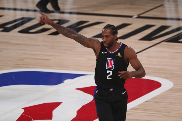 Los Angeles Clippers forward Kawhi Leonard reacts during the first half against the Dallas Mavericks in Game 1 of an NBA basketball first-round playoff series, Monday, Aug. 17, 2020, in Lake Buena Vista, Fla. (Kim Klement/Pool Photo via AP)