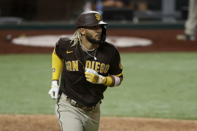 San Diego Padres' Fernando Tatis Jr. runs the bases after hitting a grand slam off of Texas Rangers relief pitcher Juan Nicasio in the eighth inning of a baseball game in Arlington, Texas, Monday Aug. 17, 2020. The shot scored Jurickson Profar, Josh Naylor and Trent Grisham. (AP Photo/Tony Gutierrez)