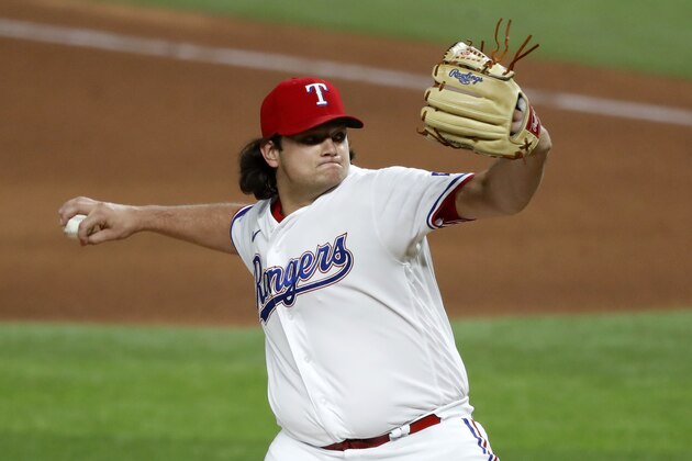 Texas Rangers relief pitcher Ian Gibaut throws to a Seattle Mariners batter during the seventh inning of a baseball game in Arlington, Texas, Wednesday, Aug. 12, 2020. (AP Photo/Tony Gutierrez)