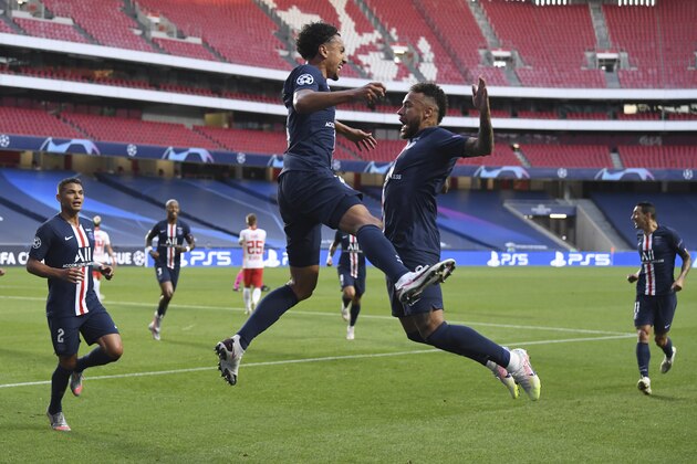 PSG's Marquinhos, left, celebrates after scoring his side's first goal during the Champions League semifinal soccer match between RB Leipzig and Paris Saint-Germain at the Luz stadium in Lisbon, Portugal, Tuesday, Aug. 18, 2020. (David Ramos/Pool Photo via AP)