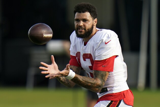 Tampa Bay Buccaneers wide receiver Mike Evans (13) makes a catch during an NFL football training camp practice Tuesday, Aug. 18, 2020, in Tampa, Fla. (AP Photo/Chris O'Meara)