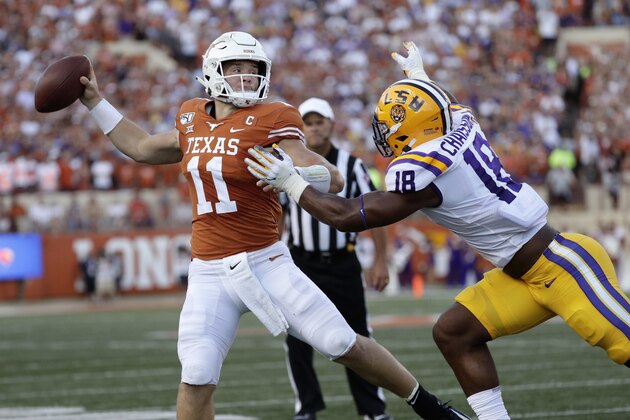 Texas quarterback Sam Ehlinger throws a pass as LSU linebacker K'Lavon Chaisson defends during the first half of an NCAA college football game Saturday, Sept. 7, 2019, in Austin, Texas. (AP Photo/Eric Gay)