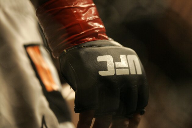 Closeup of a glove and the UFC logo at Ultimate Fighting Championship 73 on Saturday, July 7, 2007, in Sacramento, Calif.  (AP Photo/Jeff Chiu)