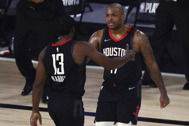 Houston Rockets forward P.J. Tucker (17) celebrates with guard James Harden (13) after making a three-pointer against the Oklahoma City Thunder in the first half of Game 1 of an NBA basketball first-round playoff series, Tuesday, Aug. 18, 2020, in Lake Buena Vista, Fla. (Kim Klement/Pool Photo via AP)