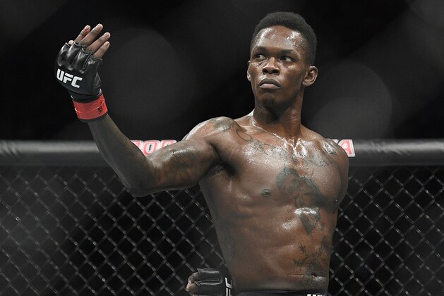 Nigeria's Israel Adesanya poses as he fights Brazil's Anderson Silva in their middleweight bout at the UFC 234 event in Melbourne, Australia, Sunday, Feb. 10, 2019. (AP Photo/Andy Brownbill)
