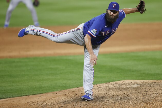 Texas Rangers starting pitcher Lance Lynn works against Colorado Rockies' Nolan Arenado for the final out in the ninth inning of a baseball game Friday, Aug. 14, 2020, in Denver. (AP Photo/David Zalubowski)