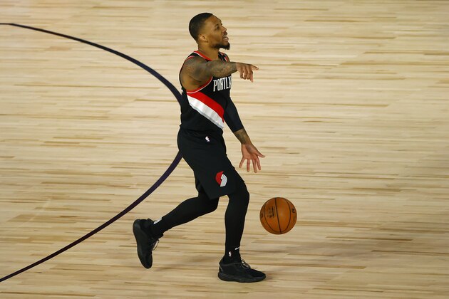 Portland Trail Blazers' Damian Lillard  sets up the play against the Memphis Grizzlies during the first half of an NBA basketball game Saturday, Aug. 15, 2020, in Lake Buena Vista, Fla. (Kevin C. Cox/Pool Photo via AP)
